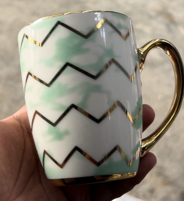 Green & white with Golden lining cup.