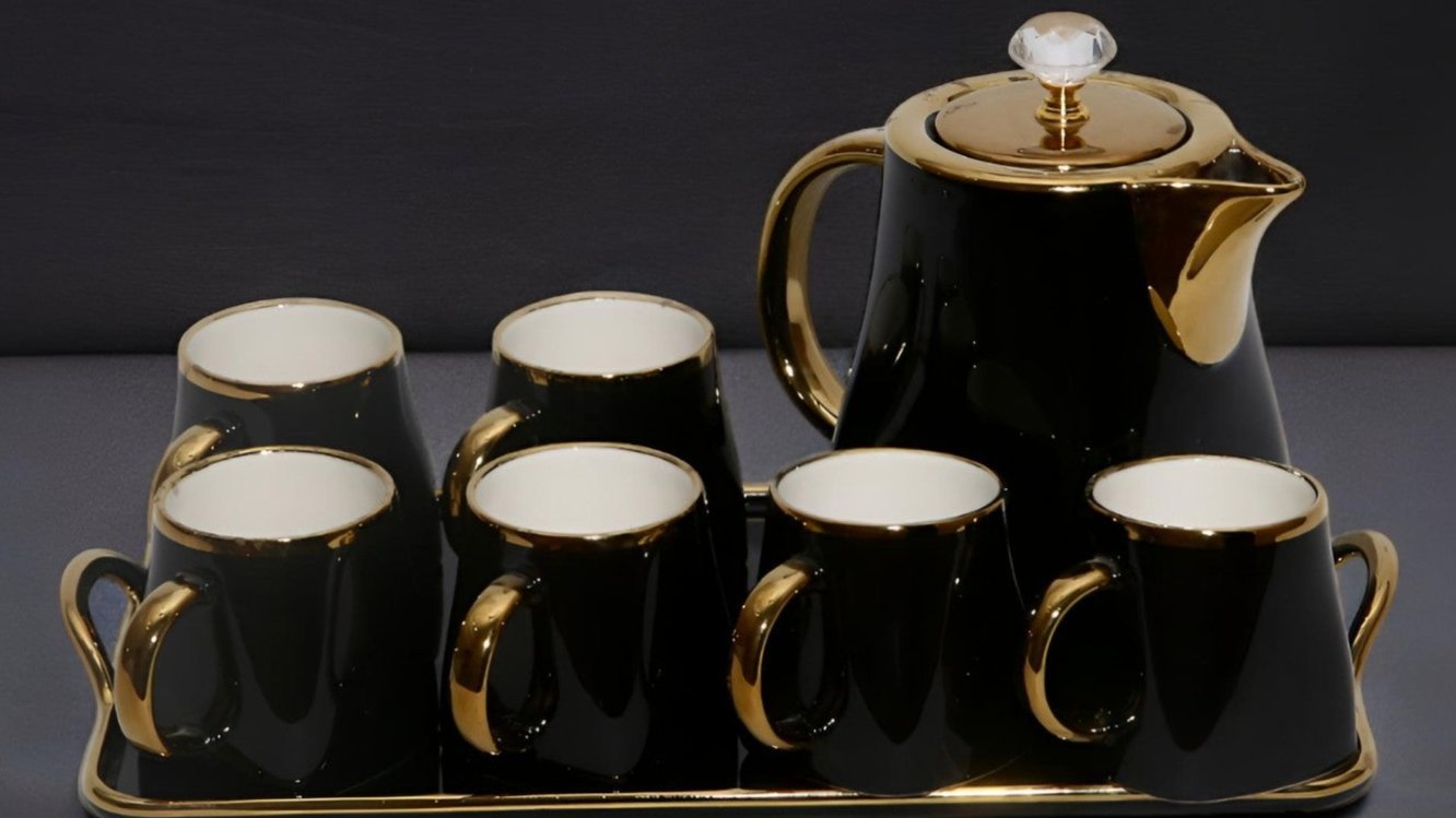 Tea set black colour with golden touch.